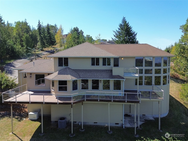 back of house with a yard, cooling unit, and a deck