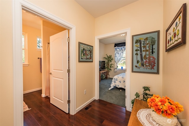 hall with dark hardwood / wood-style floors