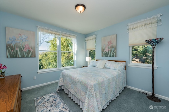 bedroom with carpet floors and baseboards