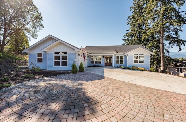 single story home featuring board and batten siding