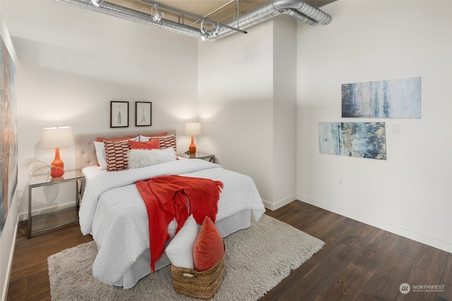 bedroom featuring dark hardwood / wood-style floors