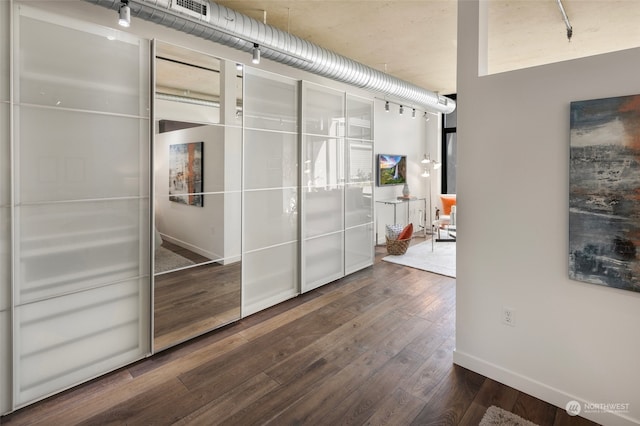 interior space with dark wood-type flooring