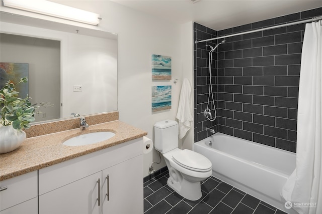 full bathroom featuring vanity, toilet, shower / bath combo with shower curtain, and tile patterned floors