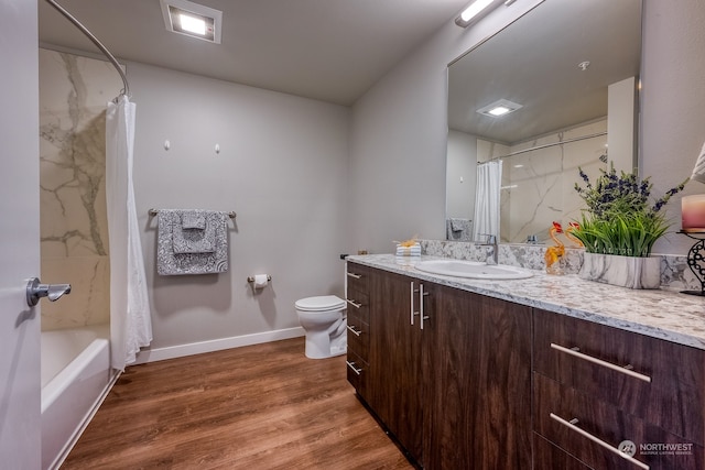 full bathroom with vanity, toilet, hardwood / wood-style floors, and shower / bathtub combination with curtain