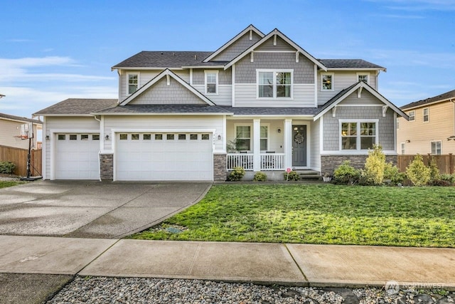 craftsman house with concrete driveway, covered porch, a garage, stone siding, and a front lawn