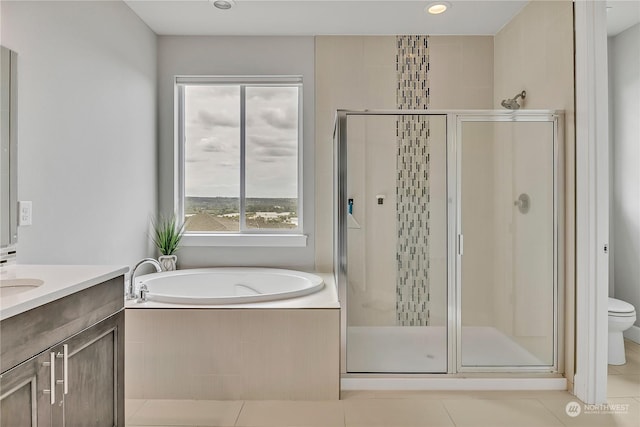 full bathroom featuring toilet, vanity, a shower stall, tile patterned flooring, and a bath