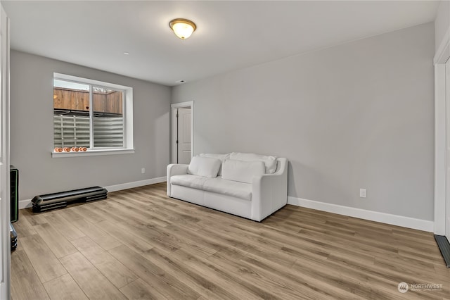 living area with light hardwood / wood-style flooring