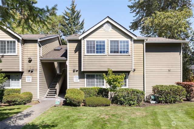 view of front of home with a front lawn