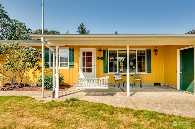 exterior space featuring a yard and a porch