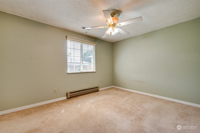 spare room with a textured ceiling, light colored carpet, ceiling fan, and a baseboard heating unit