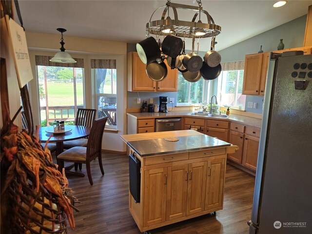 538 Canal Dr NE, Ocean Shores, WA 98569 - kitchen featuring a center island, a sink, stainless steel appliances, lofted ceiling, and dark wood-style floors