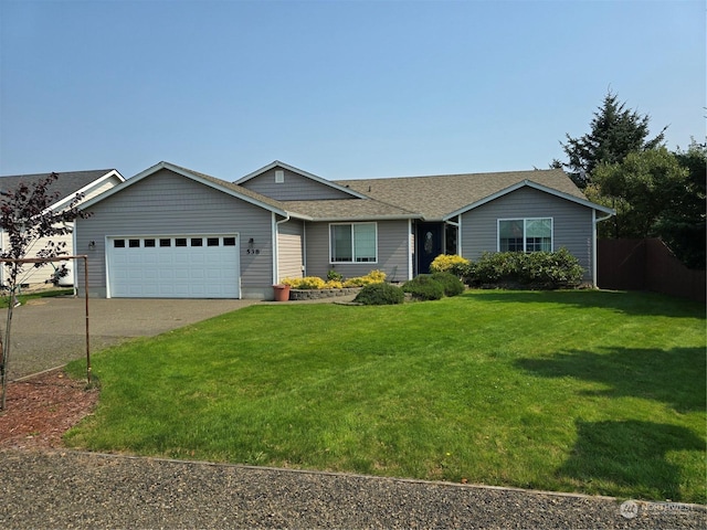 538 Canal Dr NE, Ocean Shores, WA 98569 - ranch-style house with an attached garage, fence, driveway, a front yard, and roof with shingles
