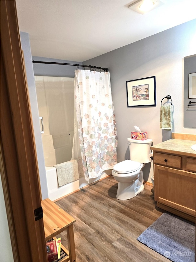 538 Canal Dr NE, Ocean Shores, WA 98569 - bathroom featuring vanity, toilet, shower / bath combo, and wood finished floors