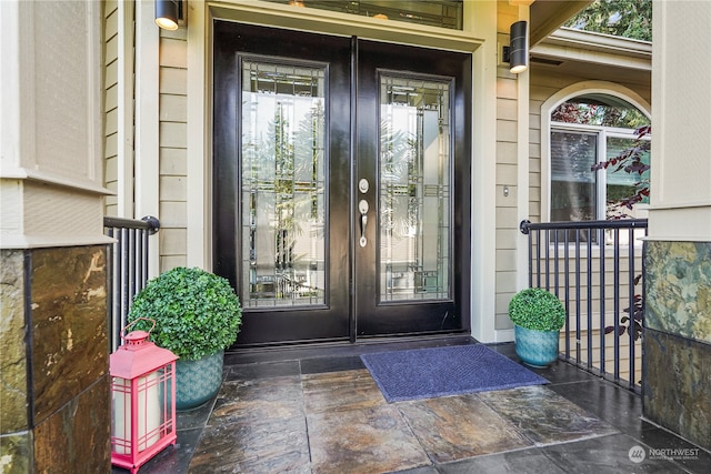 property entrance featuring french doors