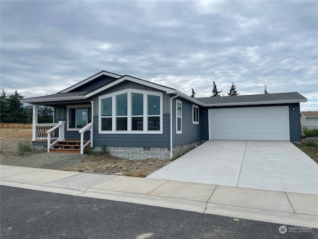 view of front of property with a garage and a porch