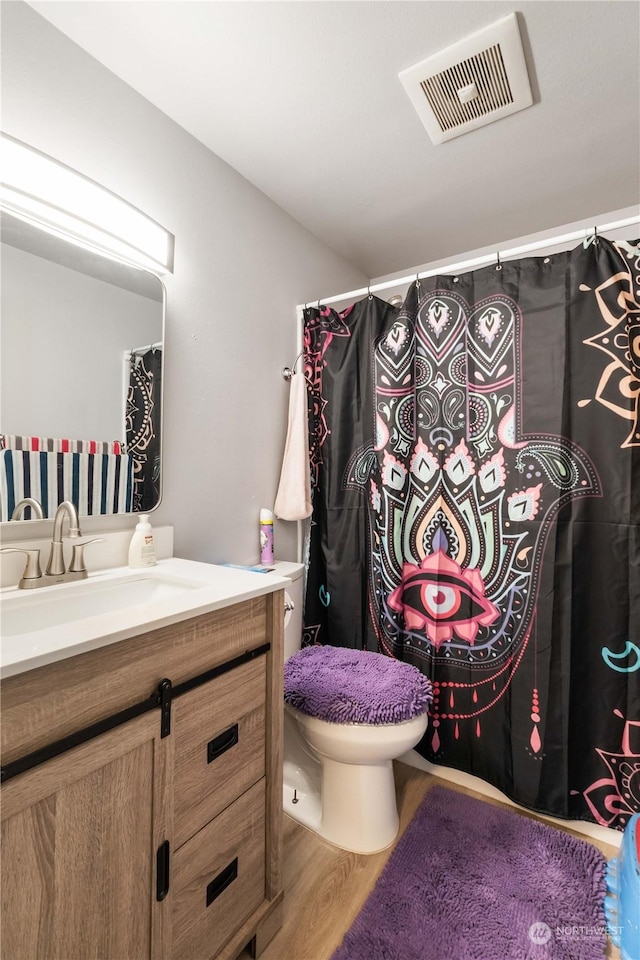 116 173rd St S, Spanaway, WA 98387 - full bathroom featuring vanity, toilet, wood finished floors, and visible vents