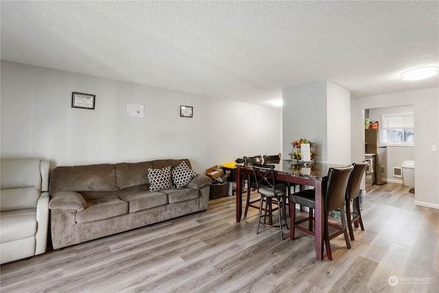 116 173rd St S, Spanaway, WA 98387 - living area featuring light wood-type flooring and a textured ceiling