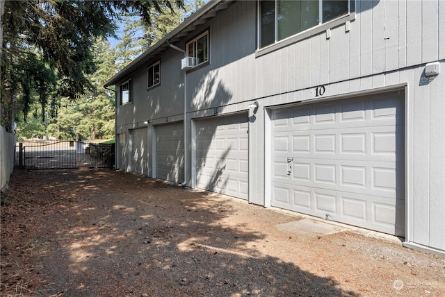 116 173rd St S, Spanaway, WA 98387 - view of side of property with cooling unit, an attached garage, and fence