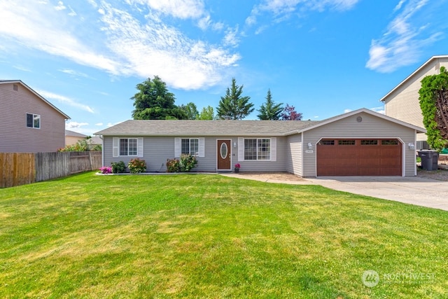 ranch-style home featuring a garage and a front yard