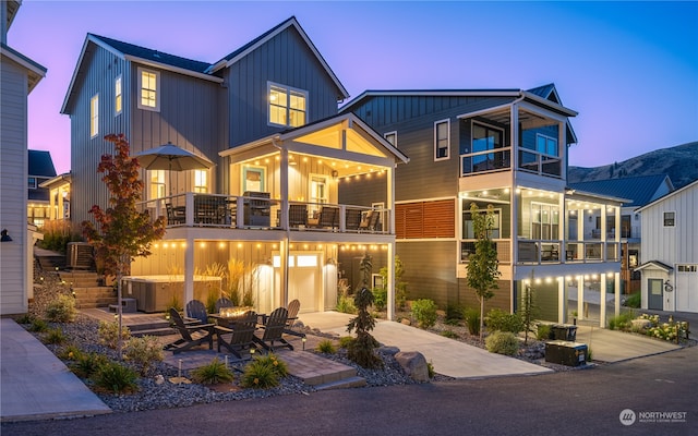 view of front facade with a balcony and a patio area