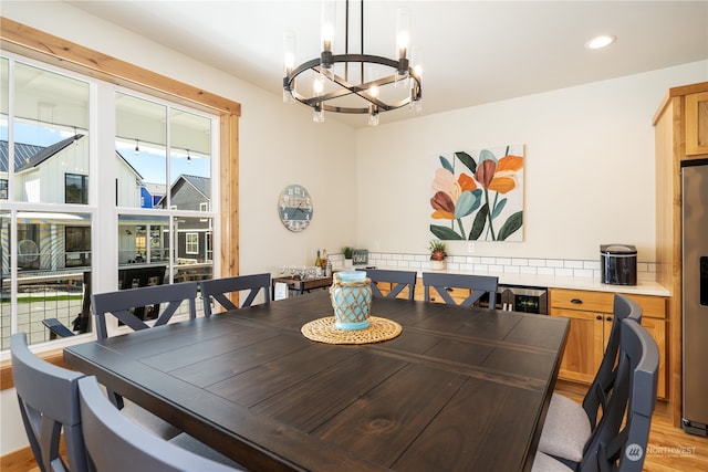 dining room featuring an inviting chandelier and light hardwood / wood-style floors