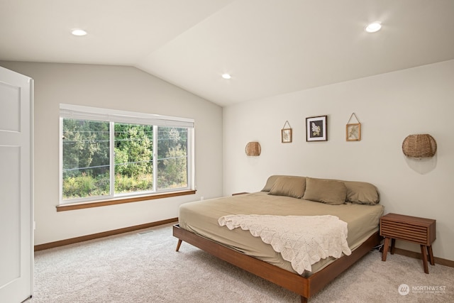 carpeted bedroom with vaulted ceiling