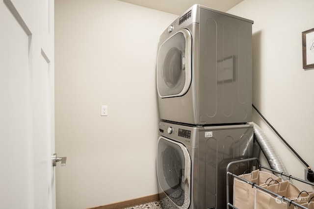 washroom featuring stacked washer / dryer