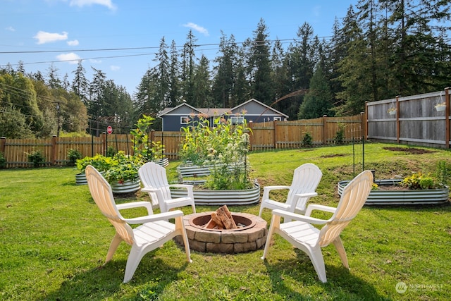 view of yard with a fire pit