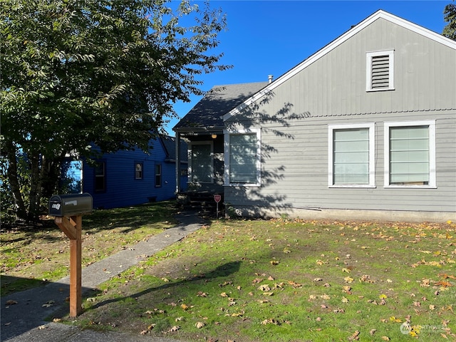 view of property exterior with a yard