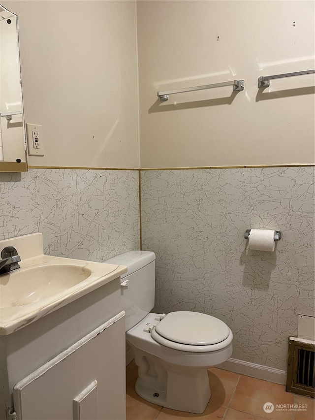 bathroom featuring tile walls, tile patterned floors, vanity, and toilet