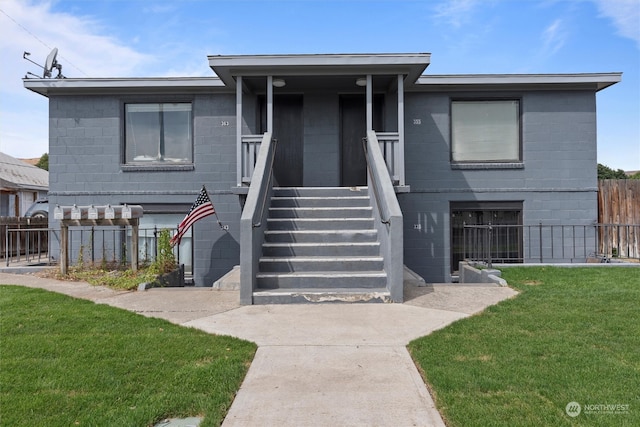 view of front of home with a front lawn