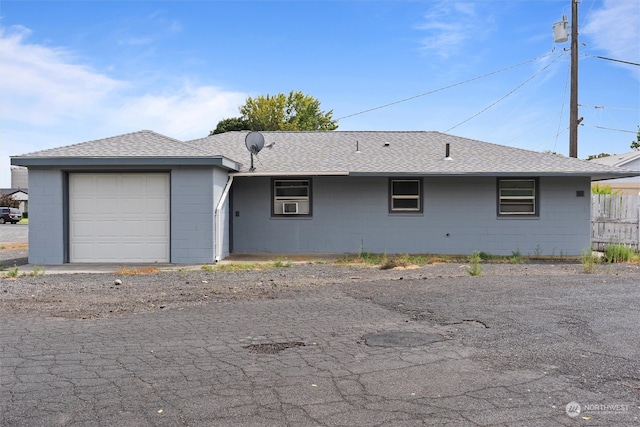 ranch-style house featuring a garage