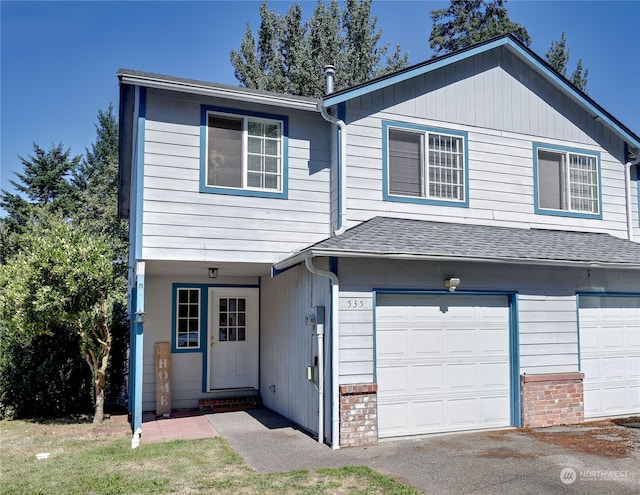 view of front of property featuring a garage