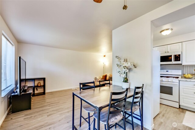 dining space featuring light hardwood / wood-style floors