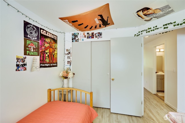 bedroom featuring a closet and light hardwood / wood-style floors