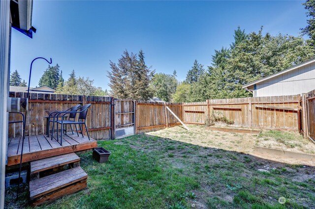 view of yard with a wooden deck