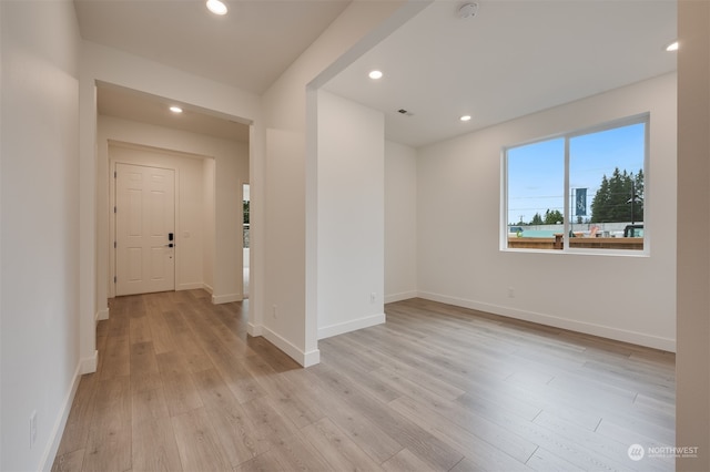 interior space with light wood-style floors, baseboards, and recessed lighting