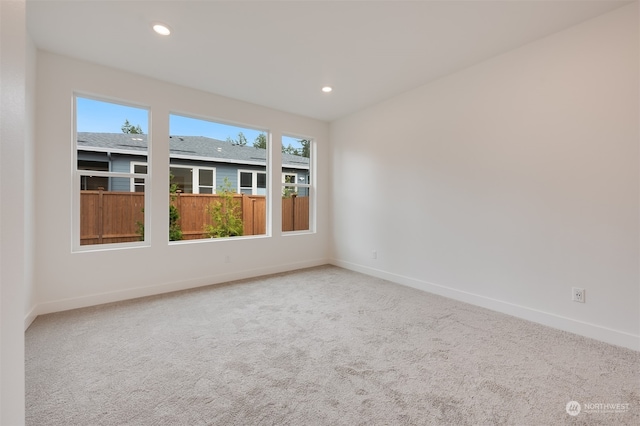 carpeted spare room with recessed lighting and baseboards