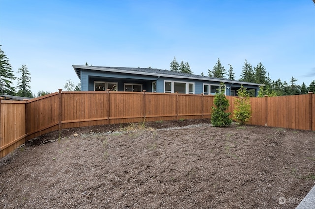 exterior space with a fenced backyard