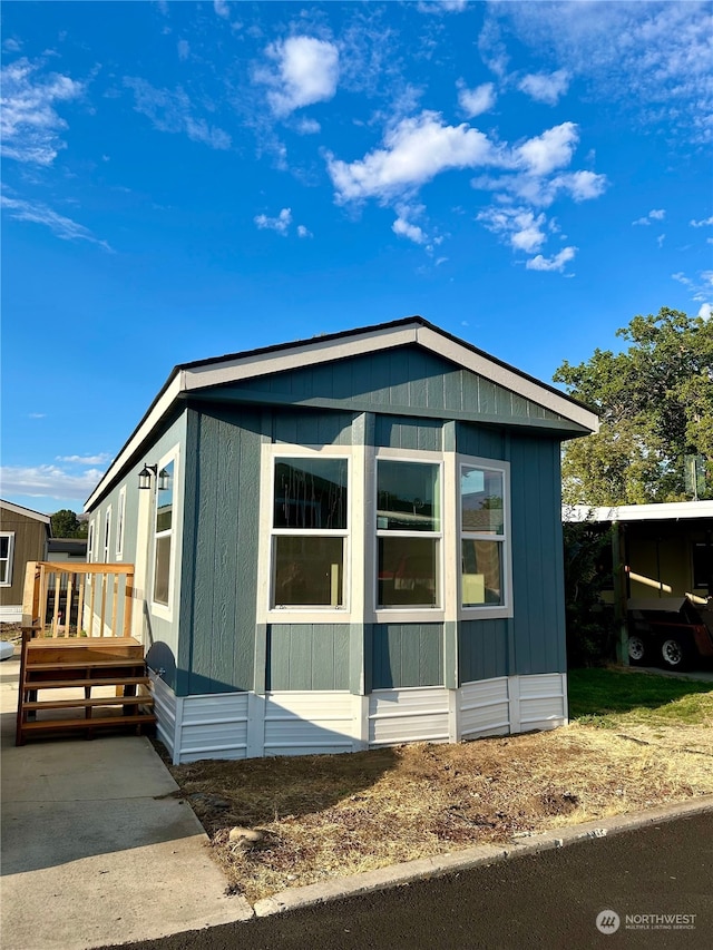 view of front of home featuring a wooden deck