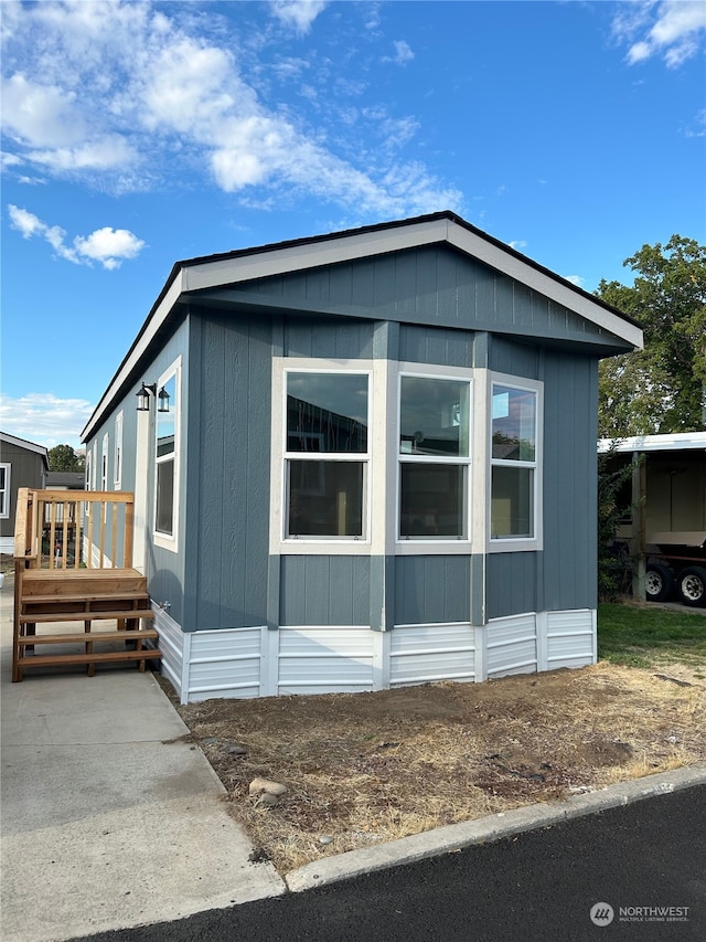 view of property exterior with a deck