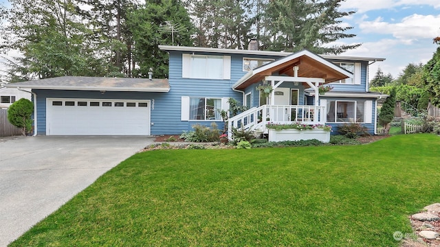 view of front of house featuring a garage, covered porch, and a front lawn