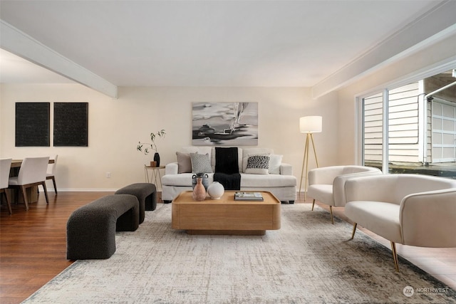 living room with beamed ceiling and hardwood / wood-style floors