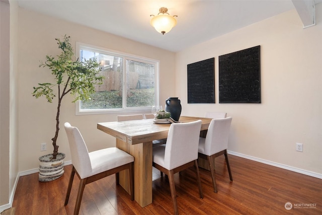 dining area featuring dark hardwood / wood-style floors