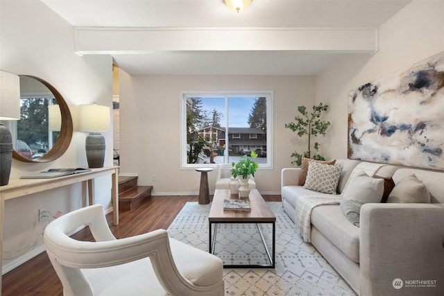 living room featuring beam ceiling and hardwood / wood-style flooring