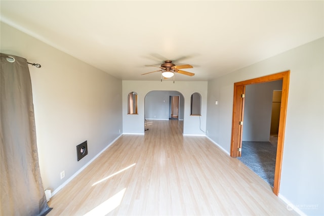 spare room with ceiling fan and hardwood / wood-style flooring