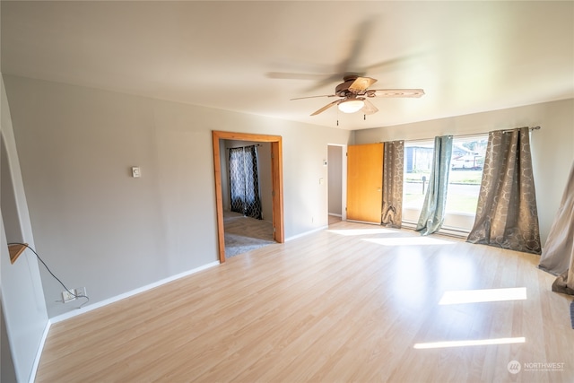 spare room featuring ceiling fan and wood-type flooring