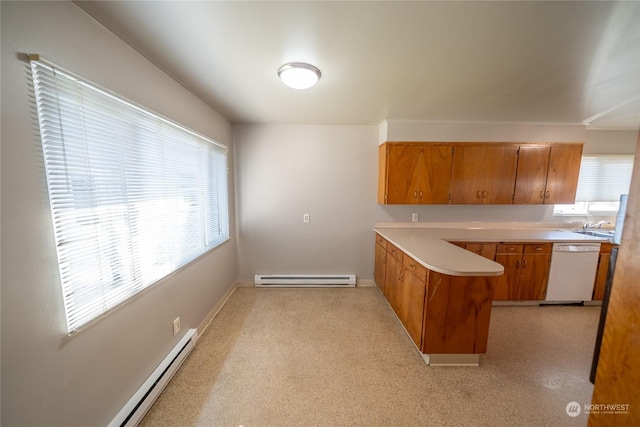 1506 Morgan St, Aberdeen, WA 98520 - kitchen with brown cabinetry, a peninsula, dishwasher, light countertops, and a baseboard radiator
