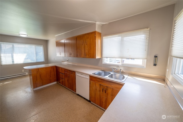 kitchen with a healthy amount of sunlight, dishwasher, baseboard heating, and sink