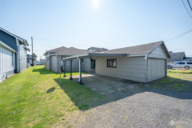 back of property with a lawn and a patio area